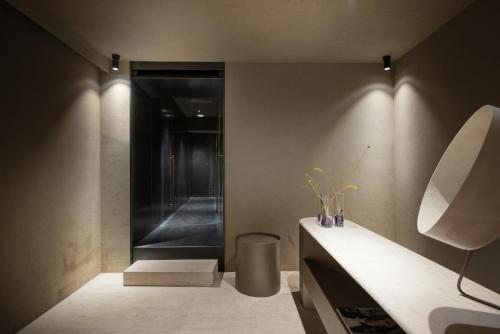 a bathroom with a counter with vases on it at Elysium Suites collection in Rome
