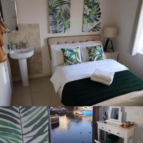 a bedroom with a bed and a sink and a bathroom at Riverside Rooms in Reading