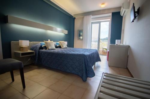 Postel nebo postele na pokoji v ubytování Hôtel Beach