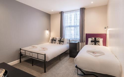 Postelja oz. postelje v sobi nastanitve Royal London Hotel By Saba