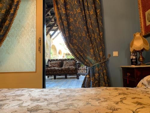 Postel nebo postele na pokoji v ubytování Casa Palacio Jerezana