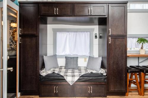 a dog bed in a kitchen with a window at Tiny House Leadville Colorado in Leadville