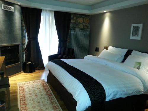 Ein Bett oder Betten in einem Zimmer der Unterkunft Miramonte Chalet Hotel Spa