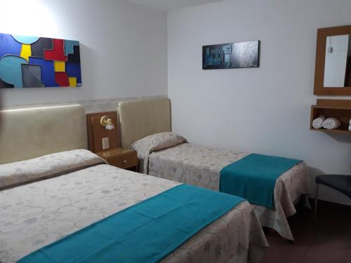 Кровать или кровати в номере Hotel Adriatico