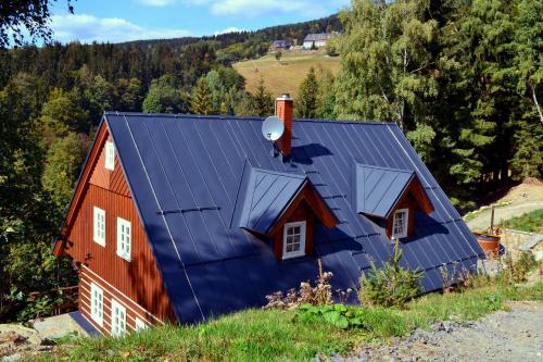 a house with a blue roof at Kajzrovka in Rokytnice nad Jizerou