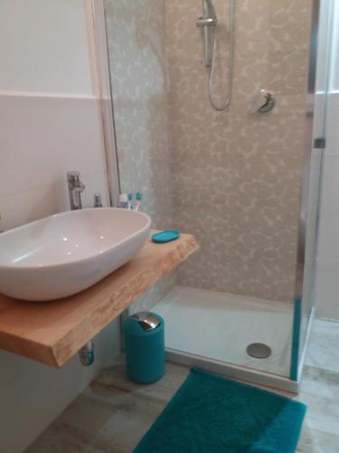 a bathroom with a sink and a shower at Sa Costera in Orosei