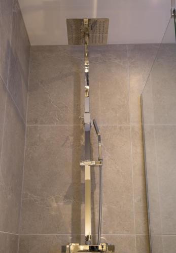 a shower stall in a bathroom with a toilet at Winckley Stays in Preston