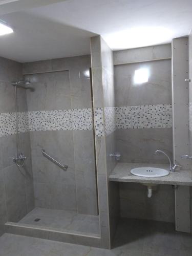 a bathroom with a shower and a sink at Apartamentos Croacia del Mar in Santa Clara del Mar