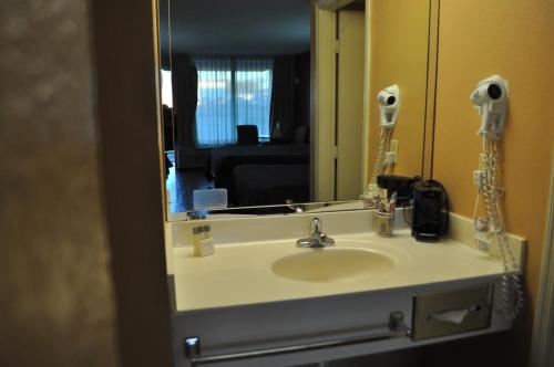 a bathroom with a sink and a mirror at Bestway Inn - Madison in Madison