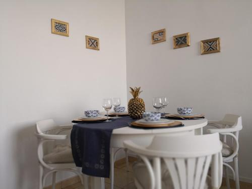 a table with a blue and white table cloth on it at Graça Lovers 2 in Lisbon
