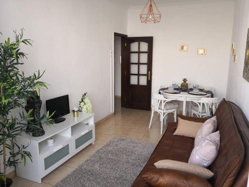 a living room with a couch and a table at Graça Lovers 2 in Lisbon