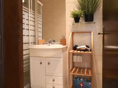 a bathroom with a sink and a mirror and a sink at Graça Lovers 2 in Lisbon