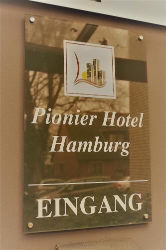 a sign for a premier hotel hanumpphrinephrineiven at Pionier Hotel Hamburg Wandsbek in Hamburg