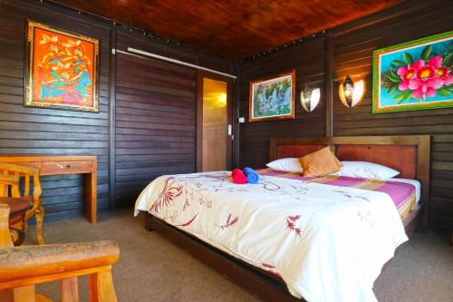 Cama o camas de una habitación en The Beach Huts Lembongan