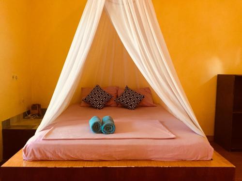 Кровать или кровати в номере Melbao Homestay