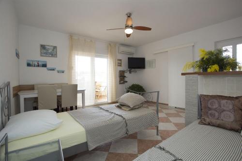 Postel nebo postele na pokoji v ubytování Apartments Gudelj
