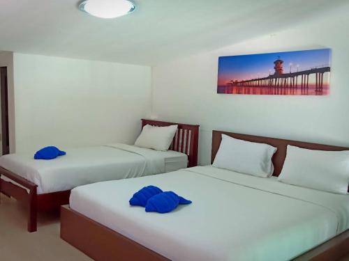 Ένα ή περισσότερα κρεβάτια σε δωμάτιο στο Blue Moon House