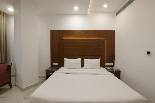 Postel nebo postele na pokoji v ubytování Grand Hotel Nawanshahr