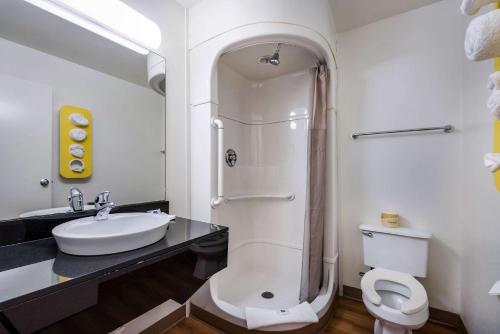 a bathroom with a sink and a shower and a toilet at Motel 6-Bessemer, AL - Birmingham in Bessemer
