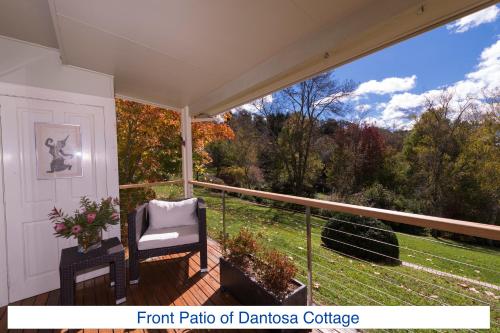 a front patio of a house with a chair on a porch at Dantosa Blue Mountains Retreat in Katoomba