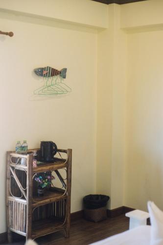 a room with a bird on the wall at Kristi House in Chiang Mai