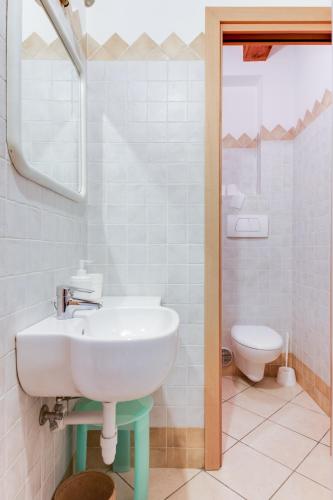 a bathroom with a sink and a toilet at Studio Mazzini in Forlì