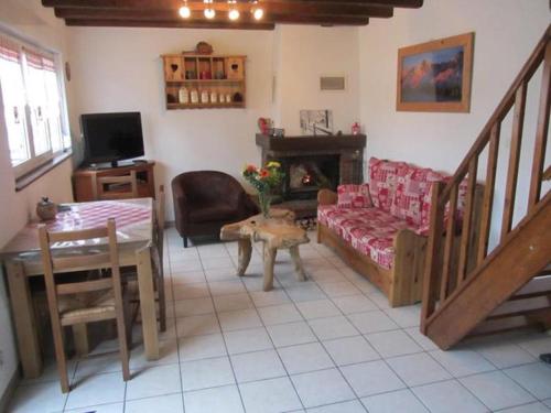 a living room with a couch and a table at Gite de Grandvillars in Grandvillars