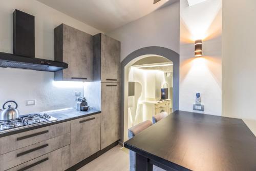 a kitchen with a black counter top in a room at Futura, Bologna by Short Holidays in Bologna