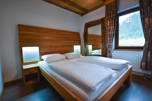Ένα ή περισσότερα κρεβάτια σε δωμάτιο στο Eko-FIS Vlašić