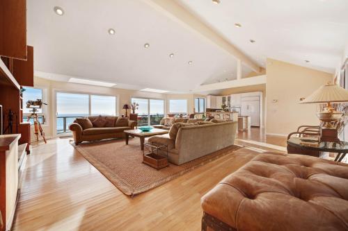 a living room with a couch and a table at The Cliff House in Gualala