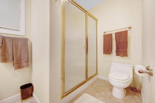 a bathroom with a toilet and a glass shower at The Cliff House in Gualala