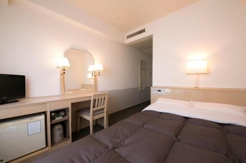 En eller flere senge i et værelse på Shimane Hamada Washington Hotel Plaza