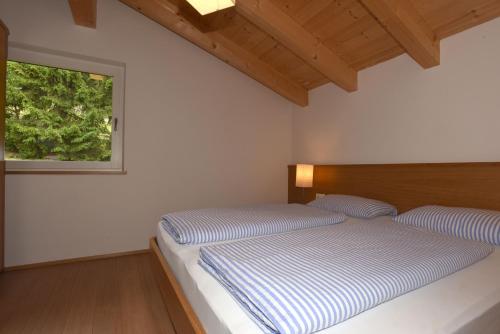 Un pat sau paturi într-o cameră la Haus Waldruhe