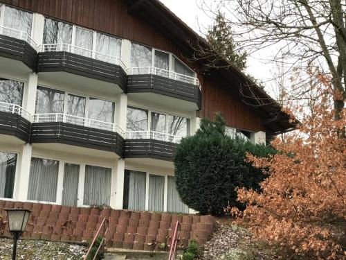 a building with a balcony on the side of it at Penz in Wolfshagen in Langelsheim