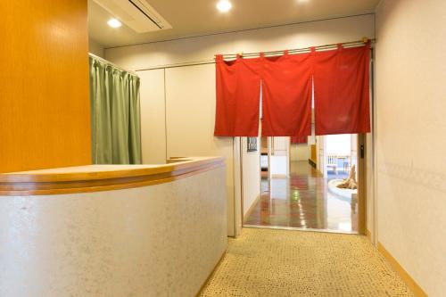 a red curtain in a room with a hallway at Shimane Hamada Washington Hotel Plaza in Hamada