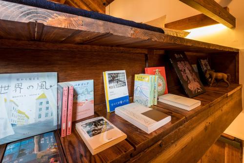 a shelf full of books on a table at The Bath & Bed Hayama in Hayama