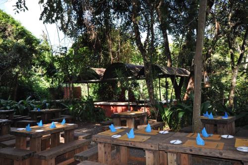 a group of picnic tables with blue birds on them at La Mada Hotel in Nairobi