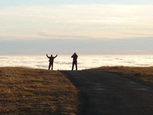 two people standing on the side of a road at Rekreace Zelba in Strážné