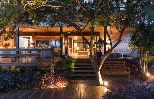 a house with a staircase leading to the front yard at Pousada Morena in Fernando de Noronha