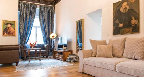 a living room with a couch and a table at Apartments Hoferhaus - Your Austrian Home in Bad Aussee