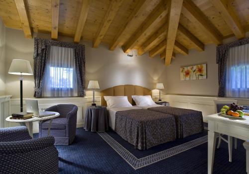 Postelja oz. postelje v sobi nastanitve Ca' Murà Natura e Resort