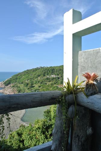 a fence with some plants on top of it at Phangan Utopia Resort in Mae Haad