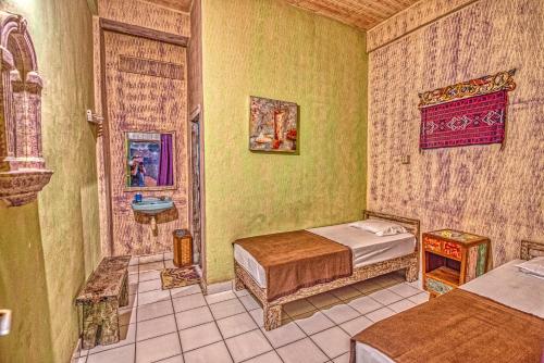 Postel nebo postele na pokoji v ubytování Lovina Central Hostel