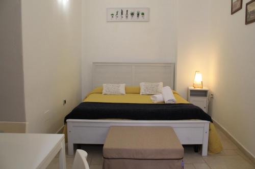 a small bedroom with a bed in a room at Mamma Maria 2010 in Monopoli
