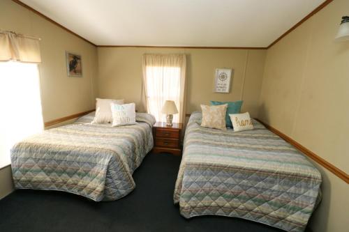 A bed or beds in a room at Island Club #9