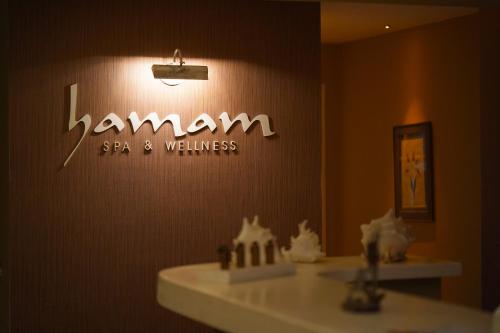 a sign that says hamann spa and wellness on a wall at Yacht Classic Hotel - Boutique Class in Fethiye