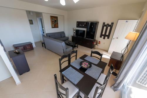 an aerial view of a living room with a table and chairs at Grand Suites with Private Pools in Kalamata