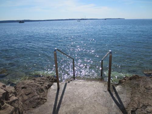 a set of stairs leading into the water at Apartments Jago in Piran