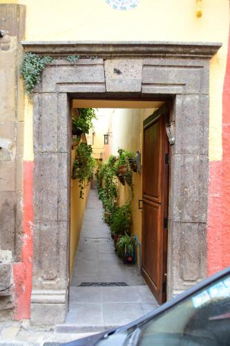 an alley way in a building with a door at Casa Maricela B&B in San Miguel de Allende