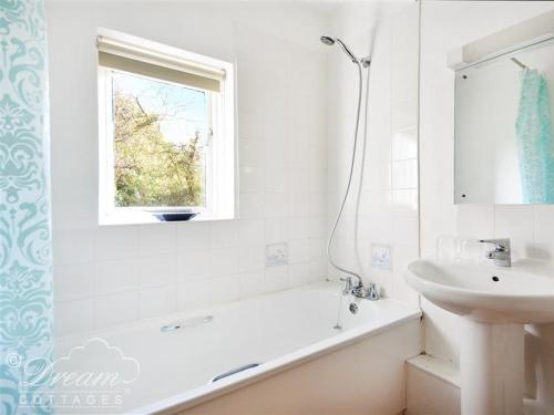 A bathroom at Whispering Pines Cottage